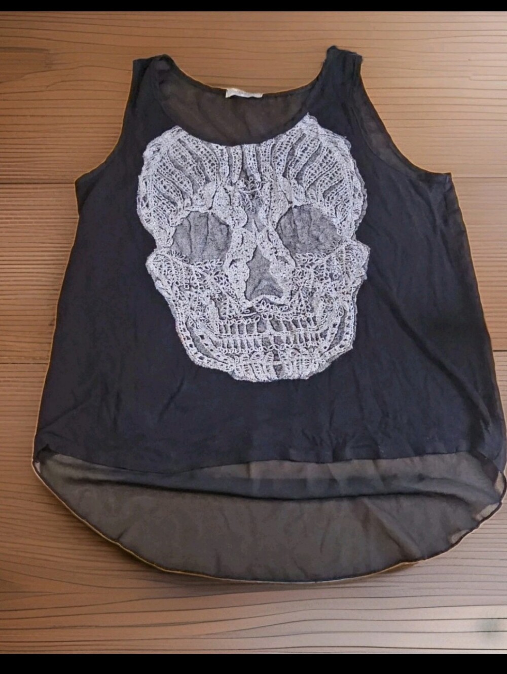 Retro black with white skull graphic high-low tank top.